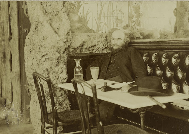 Verlaine drinking absinthe in the Café François 1er in 1892, photographed by Paul Marsan Dornac