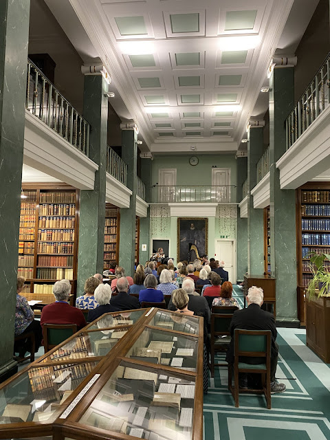 Siren Duo (Claire Wickes, flute, and Tomos Xerri, harp) in Middle Temple Library.