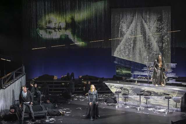 Wagner: The Flying Dutchman - Edgaras Montvidas as Erik/ Steersman, Layla Claire as Senta and Robert Hayward as The Dutchman with members of the Chorus of Opera North - Opera North (Photo: James Glossop)