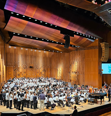 MiSST Symphony Orchestra and massed voices in rehearsal at the Barbican