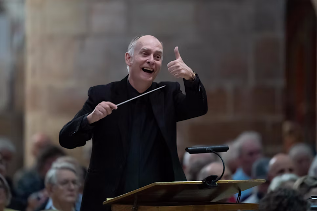 Adrian Partington conducting Berlioz's Te Deum at 2025 Cheltenham Music Festival